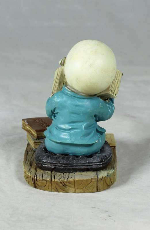 A baby Buddha - Monk reading