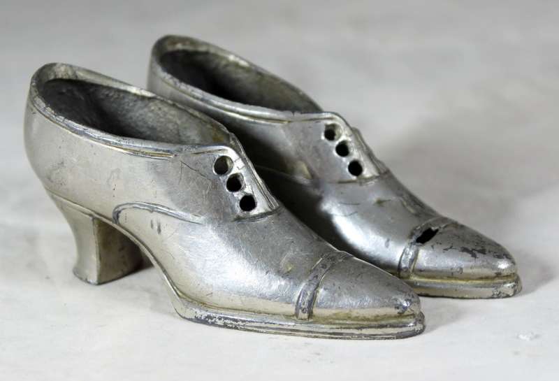 a pair of plated tin boots - made in Germany