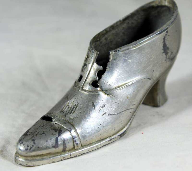 a pair of plated tin boots - made in Germany