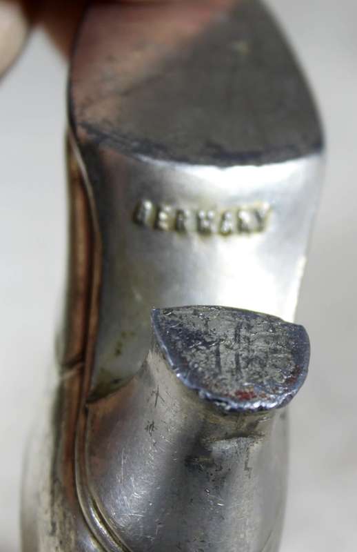 a pair of plated tin boots - made in Germany
