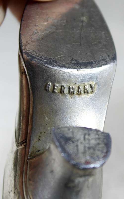 a pair of plated tin boots - made in Germany