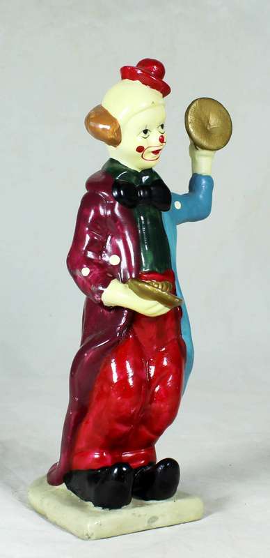 Clown figurine playing symbols