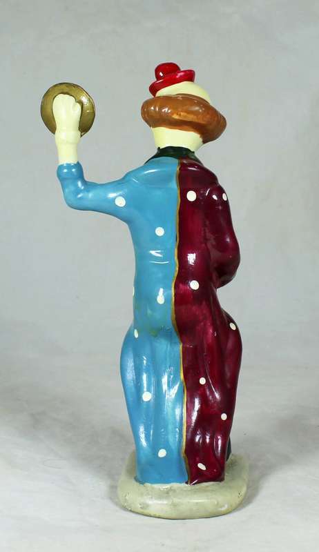 Clown figurine playing symbols