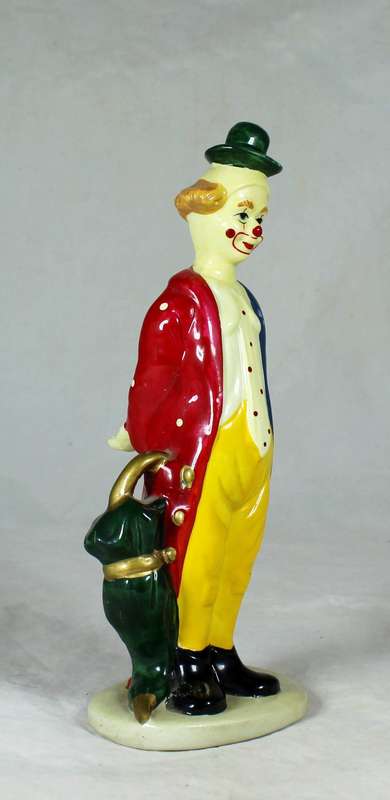Clown figurine holding an umbrella