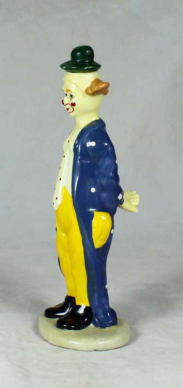 Clown figurine holding an umbrella