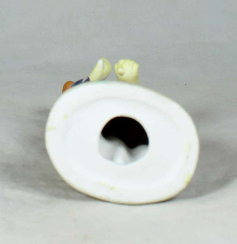 Clown figurine holding an umbrella