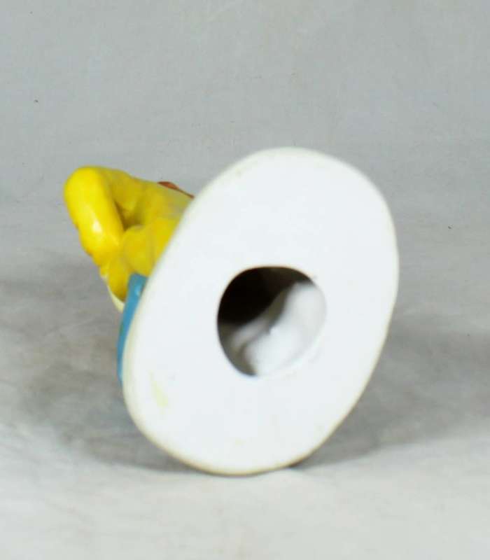 Clown figurine riding a uni-cycle