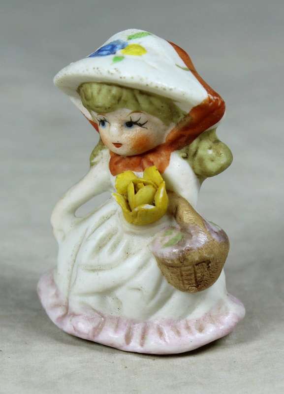 Miniature girl with a basket