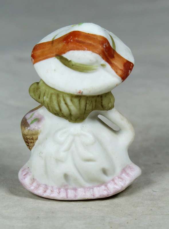 Miniature girl with a basket