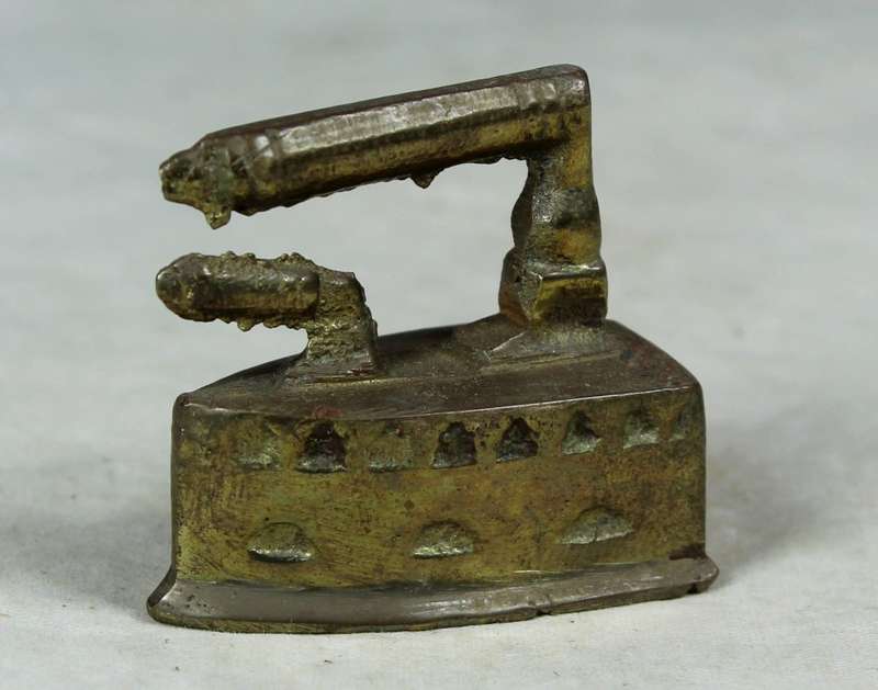 Miniature brass coal iron
