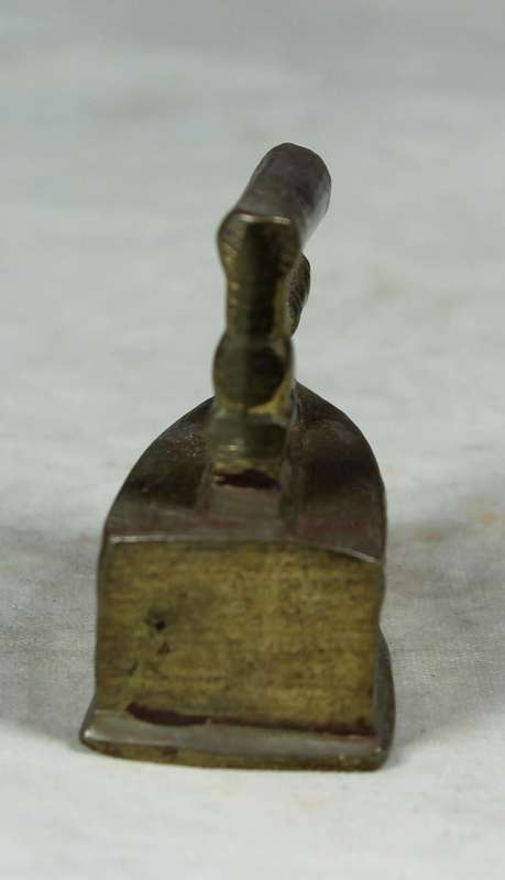 Miniature brass coal iron