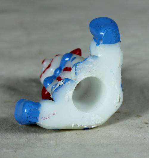Miniature blue and white clown with red ears