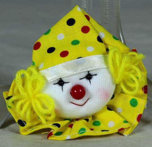 Yellow and white clown brooch