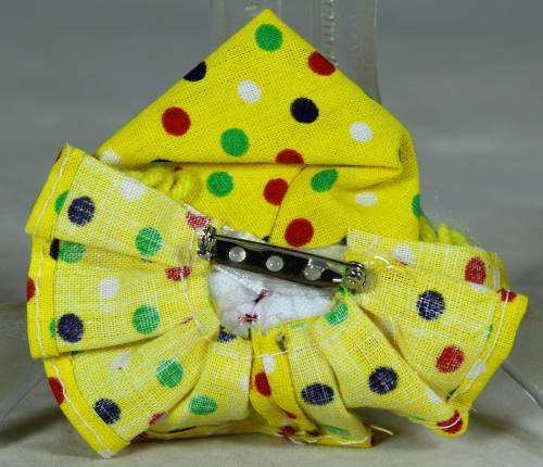 Yellow and white clown brooch