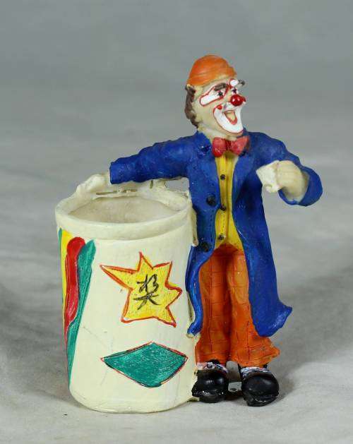 CLOWN DRESSED IN BLUE WITH A TOOTHPICK HOLDER