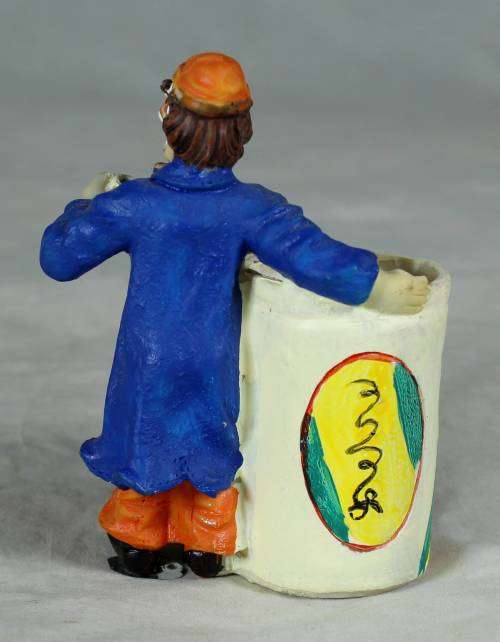 CLOWN DRESSED IN BLUE WITH A TOOTHPICK HOLDER