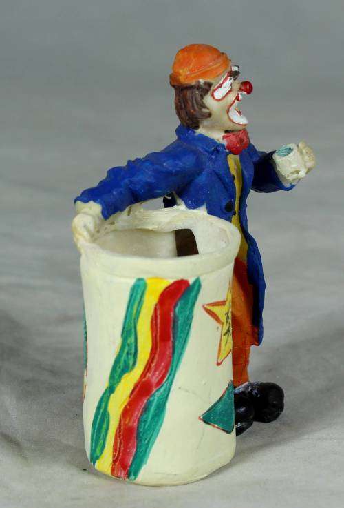 CLOWN DRESSED IN BLUE WITH A TOOTHPICK HOLDER