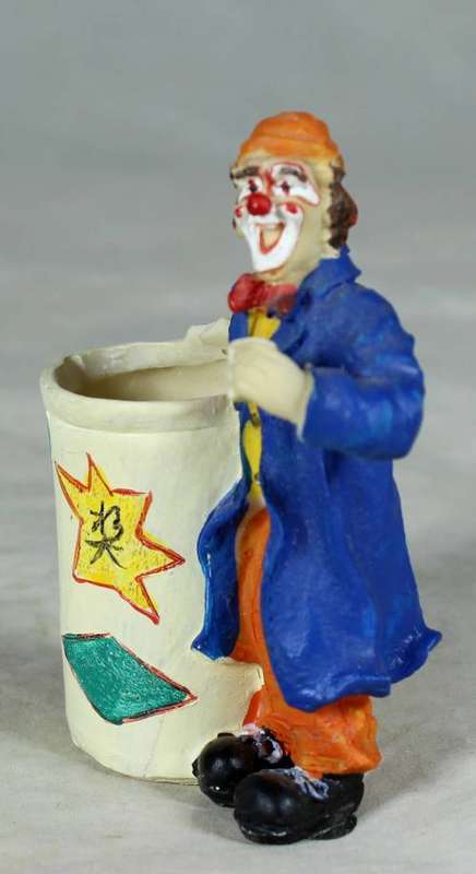 CLOWN DRESSED IN BLUE WITH A TOOTHPICK HOLDER