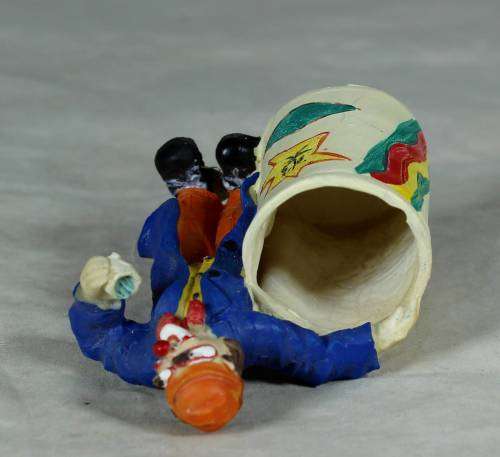 CLOWN DRESSED IN BLUE WITH A TOOTHPICK HOLDER