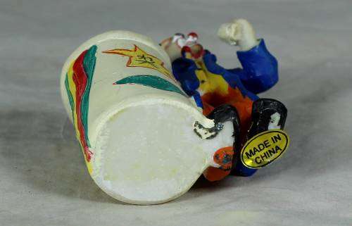 CLOWN DRESSED IN BLUE WITH A TOOTHPICK HOLDER