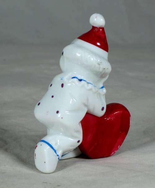 PORCELAIN CLOWN HOLDING AN `I LOVE YOU HEART