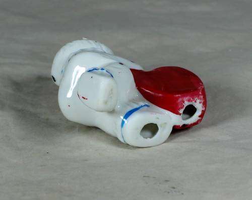 PORCELAIN CLOWN HOLDING AN `I LOVE YOU HEART