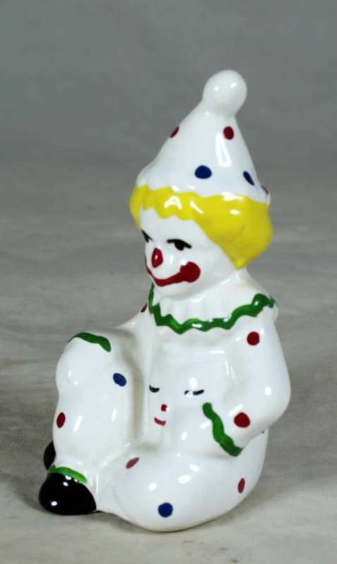 GREEN & WHITE PORCELAIN CLOWN WITH YELLOW HAIR