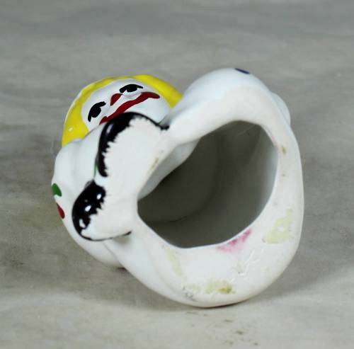 GREEN & WHITE PORCELAIN CLOWN WITH YELLOW HAIR