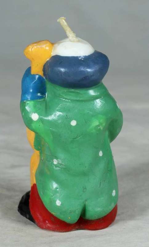 Candle clown playing a base guitar