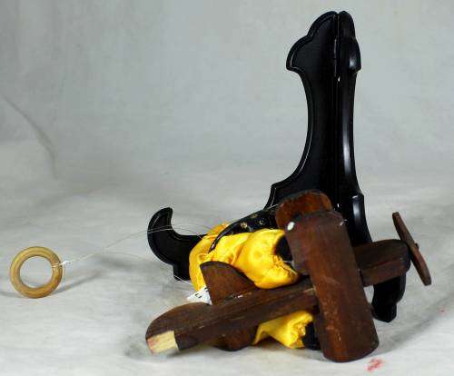CLOWN SITTING IN A PLANE HANGING FROM A ROPE  - BID NOW!!