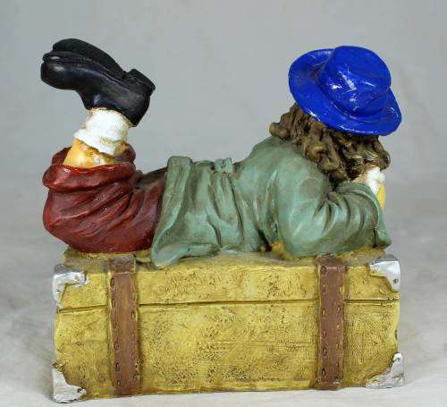 Clown laying on a treasure chest