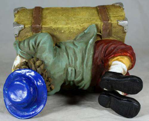 Clown laying on a treasure chest