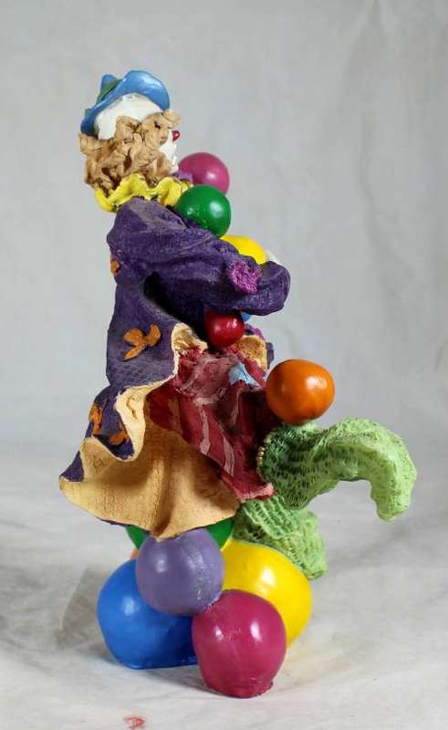 CLOWN STANDING ON BALLS WHILE JUGGLING BALLS - BID NOW!!