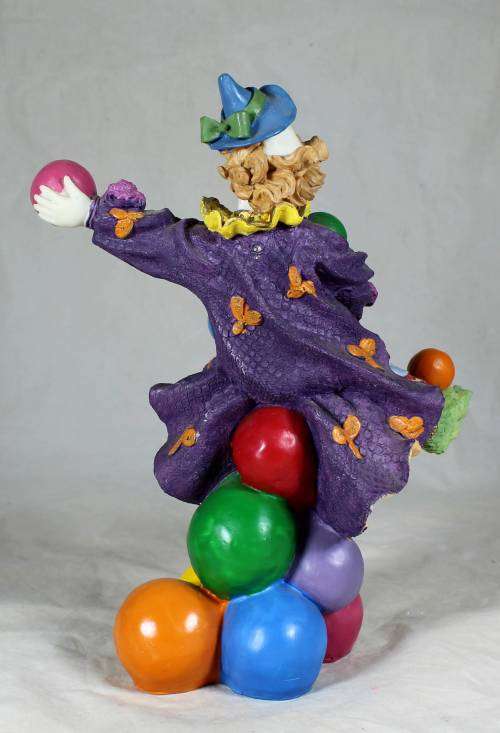 CLOWN STANDING ON BALLS WHILE JUGGLING BALLS - BID NOW!!