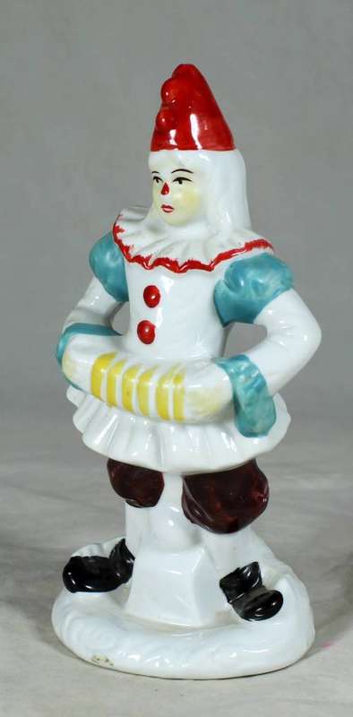 PORCELAIN CLOWN PLAYING THE CONCERTINA ON A STAND - BID NOW!!