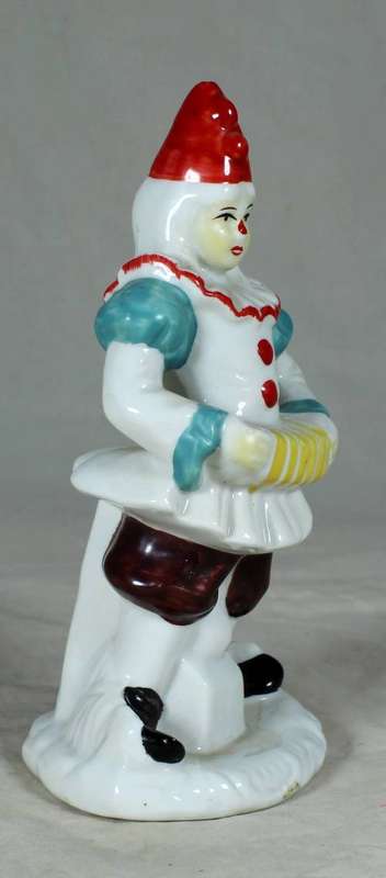 PORCELAIN CLOWN PLAYING THE CONCERTINA ON A STAND - BID NOW!!
