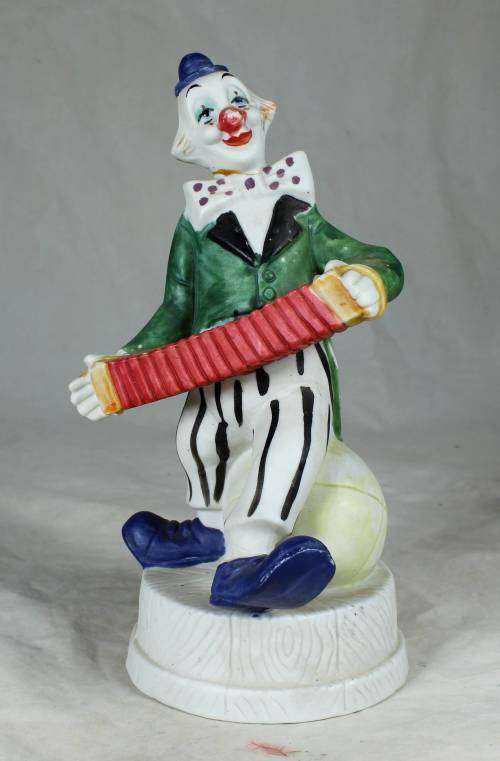 CLOWN ON A STAND PLAYING A CONCERTINA - BID NOW!!