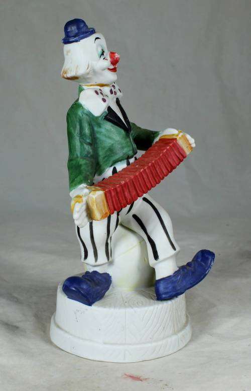 CLOWN ON A STAND PLAYING A CONCERTINA - BID NOW!!