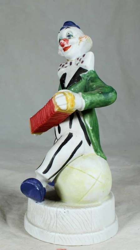 CLOWN ON A STAND PLAYING A CONCERTINA - BID NOW!!