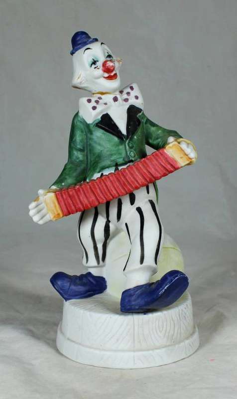 CLOWN ON A STAND PLAYING A CONCERTINA - BID NOW!!