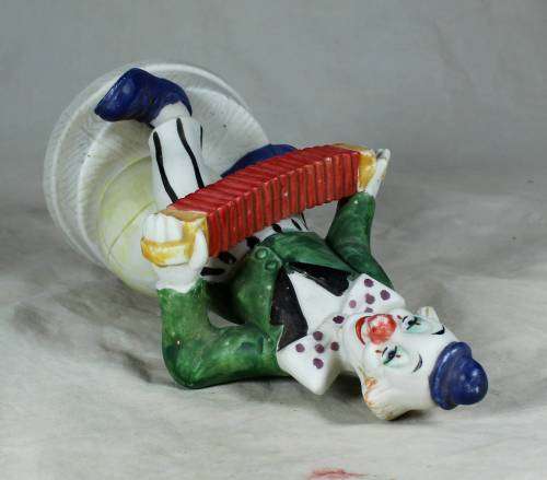 CLOWN ON A STAND PLAYING A CONCERTINA - BID NOW!!