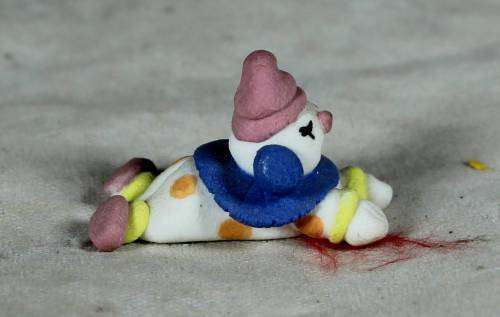 MINIATURE CLOWN LAYING DOWN - BID NOW!!