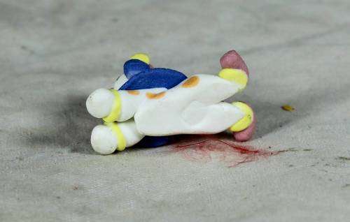 MINIATURE CLOWN LAYING DOWN - BID NOW!!
