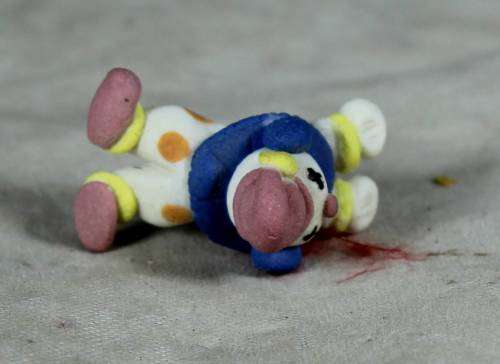 MINIATURE CLOWN LAYING DOWN - BID NOW!!