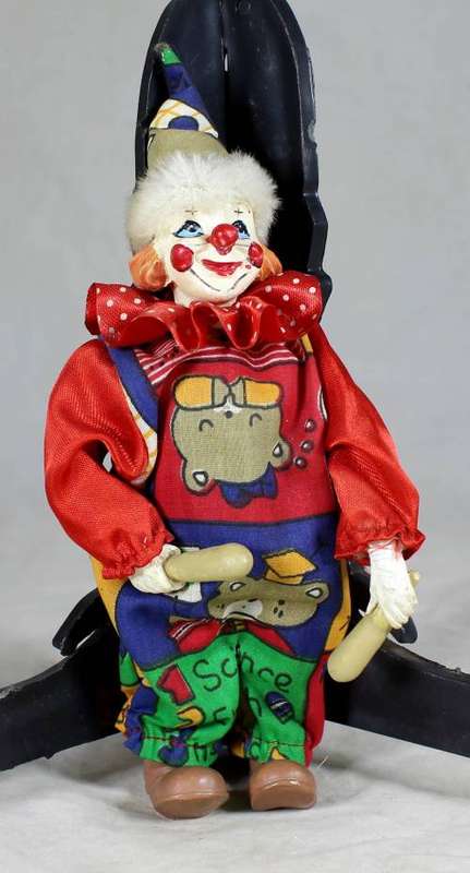 CLOWN IN A RED SUIT PLAYING - BID NOW!!