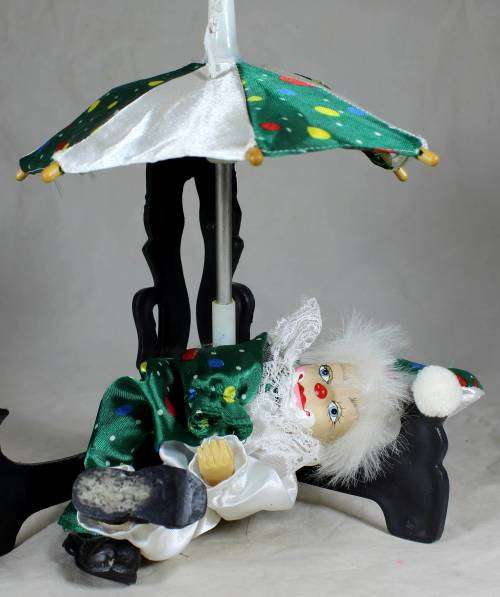 CLOWN LYING DOWN WITH AN UMBRELLA - BID NOW!!