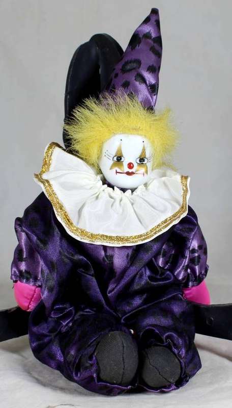 Pierrot clown in a purple suit