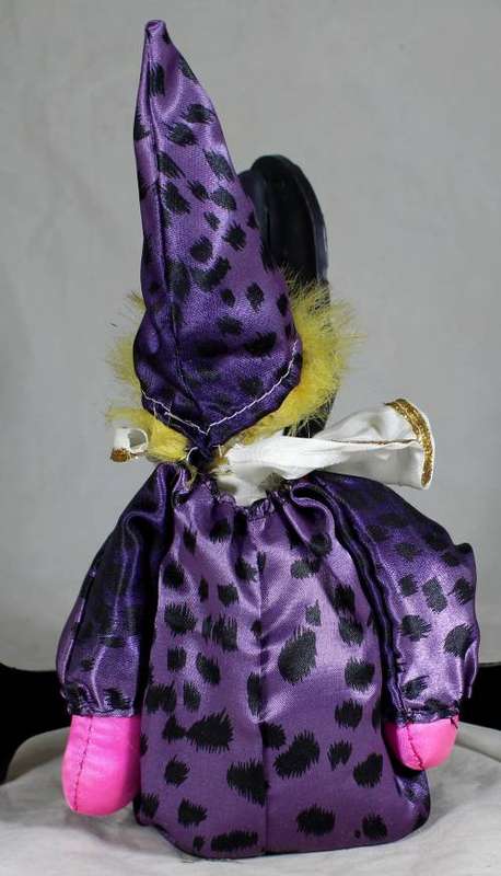 Pierrot clown in a purple suit