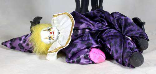 Pierrot clown in a purple suit