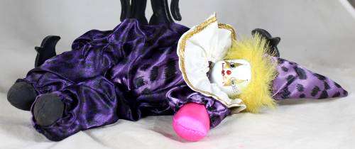 Pierrot clown in a purple suit